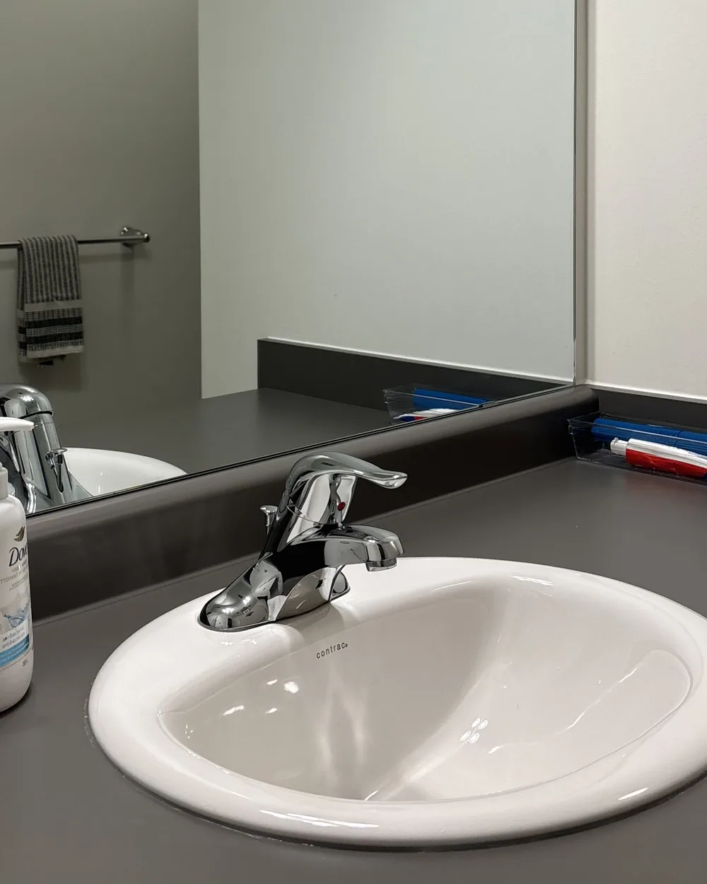 The same bathroom sink and counter wiped clean