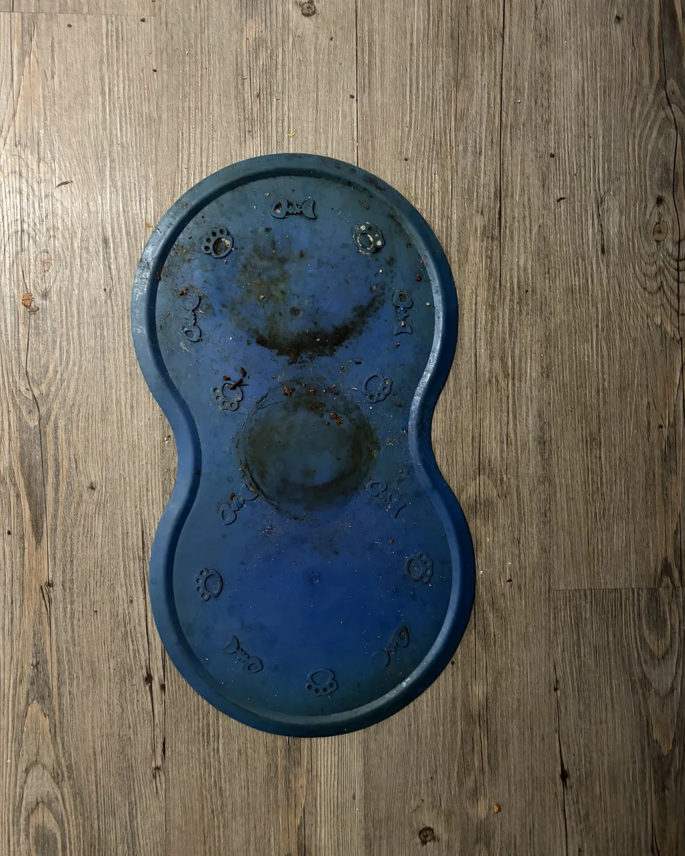A pet feeding mat with dried on stains