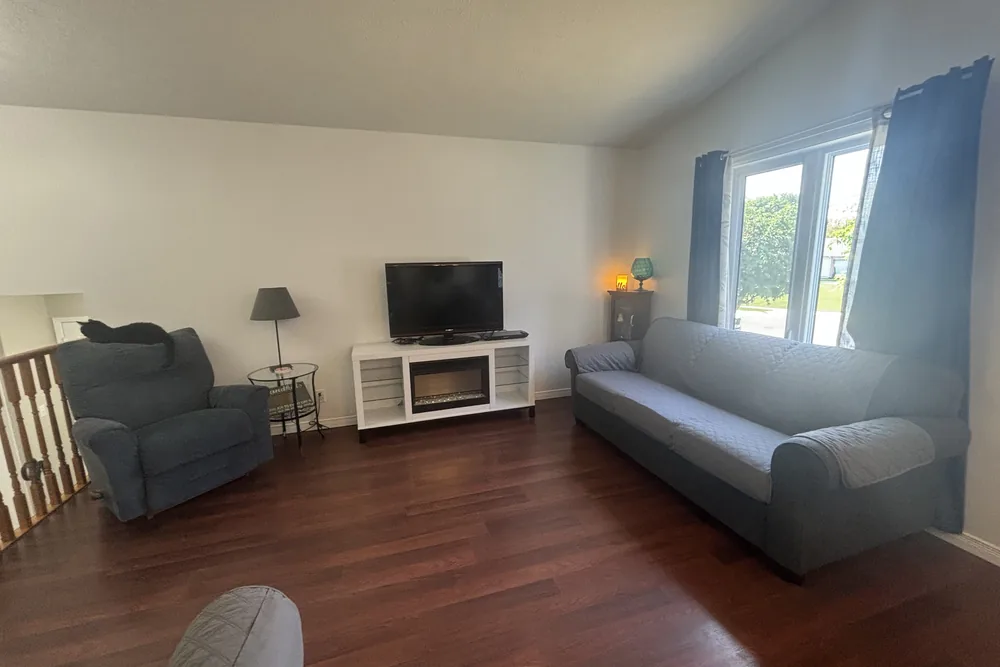 A tidy living room with clean wood floors